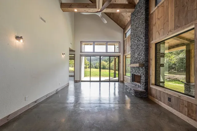 a view of an entryway with a floor to ceiling window