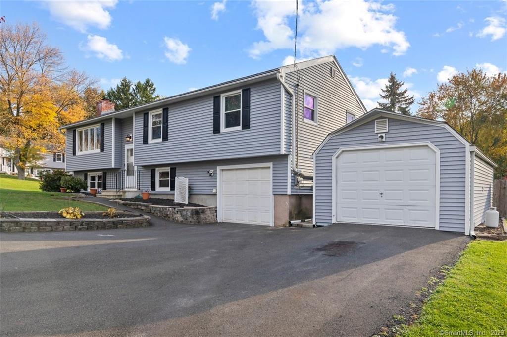 10 Marks Drive West Haven, CT 06516 - Photo 1 of 1 a front view of a house with a yard and garage