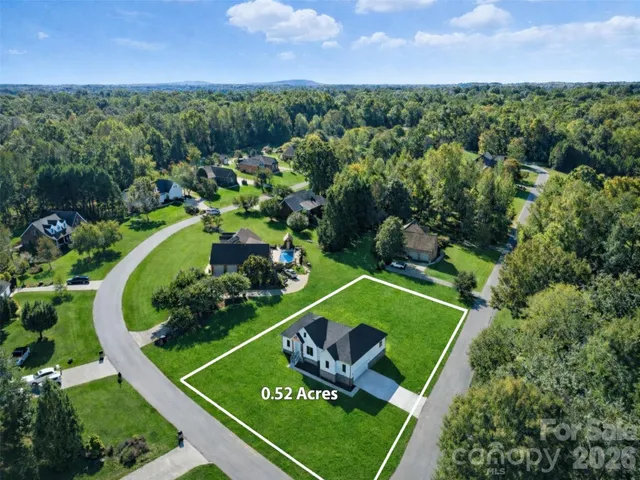 an aerial view of a golf course with outdoor space