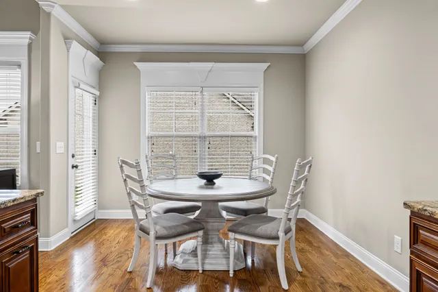a view of a dining room with furniture and window
