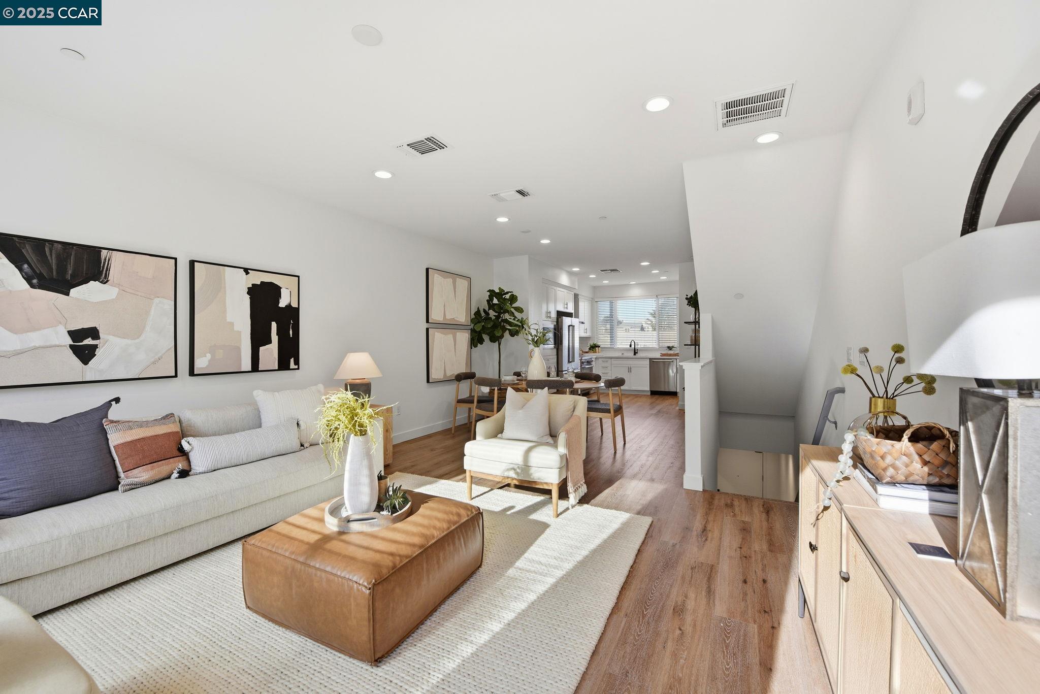 967 24th Street Oakland, CA 94607 - Photo 11 of 43 a living room with furniture and a wooden floor