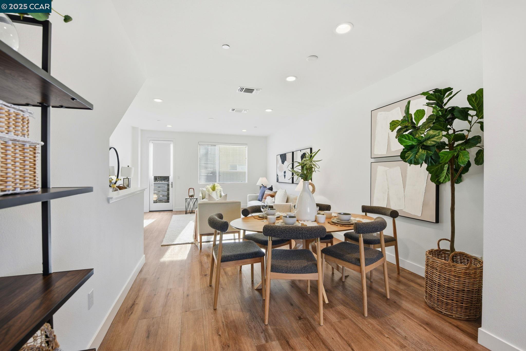 967 24th Street Oakland, CA 94607 - Photo 12 of 43 a view of a dining room with furniture and wooden floor