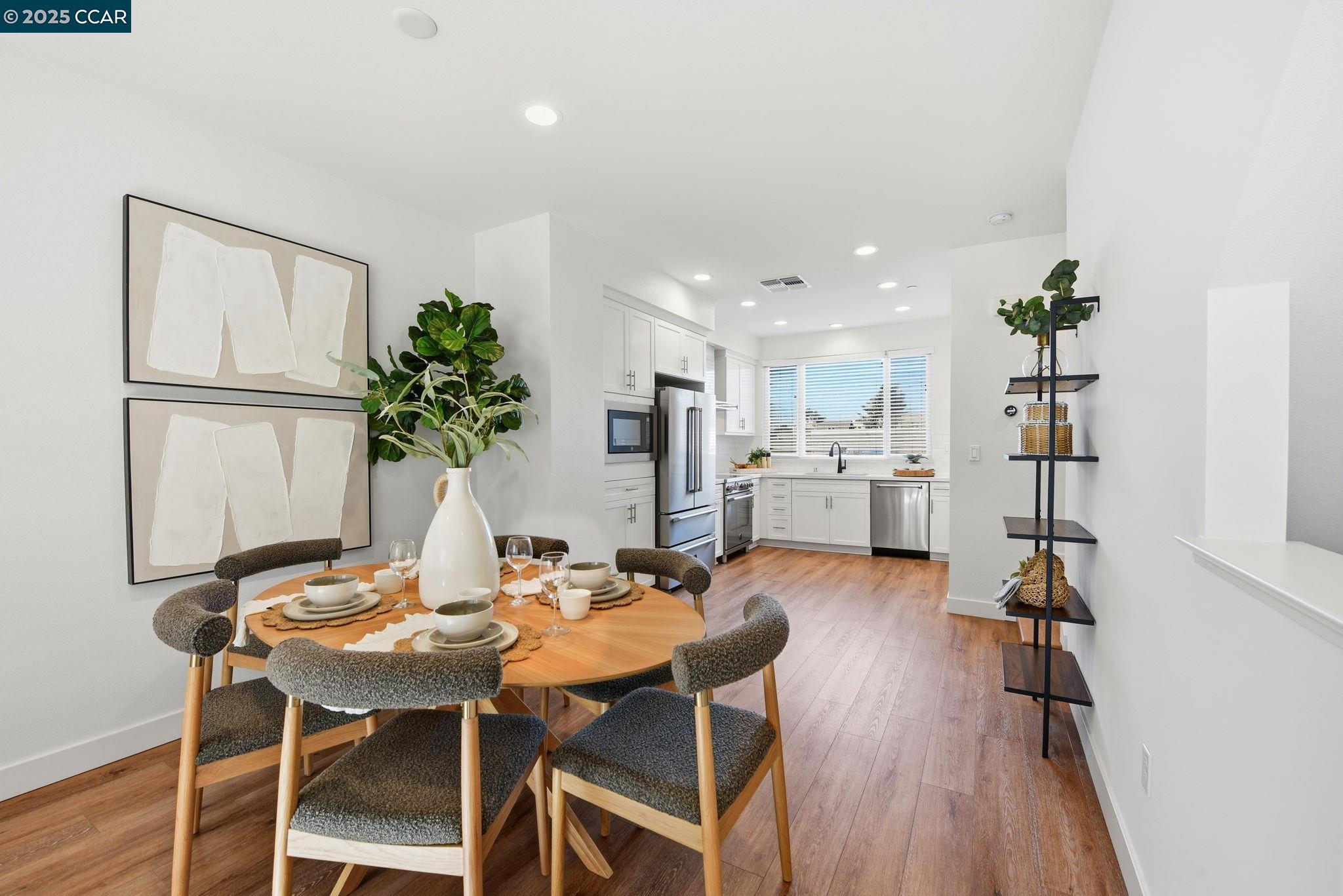 967 24th Street Oakland, CA 94607 - Photo 13 of 43 a view of a dining room with furniture and wooden floor