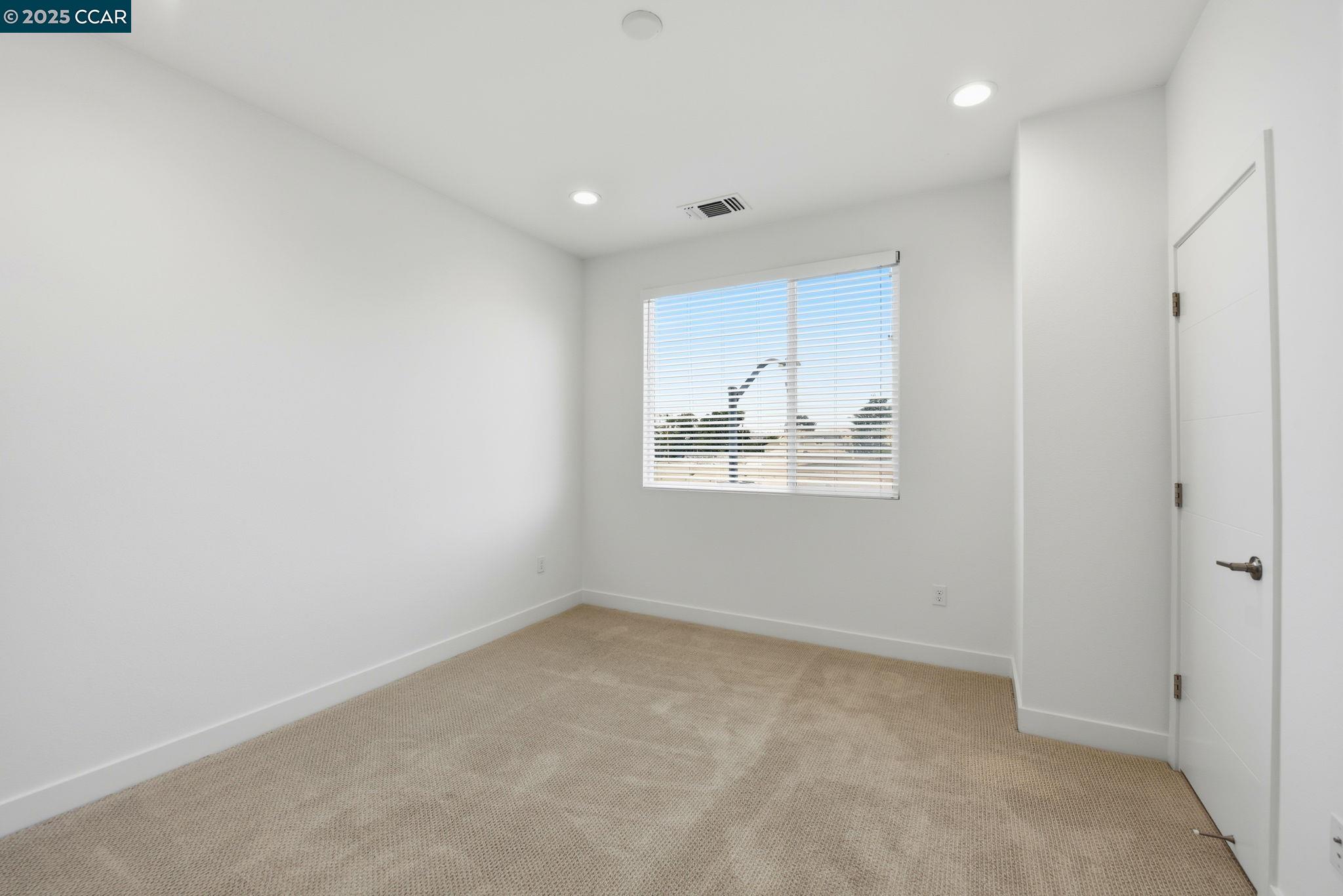 967 24th Street Oakland, CA 94607 - Photo 19 of 43 an empty room with windows
