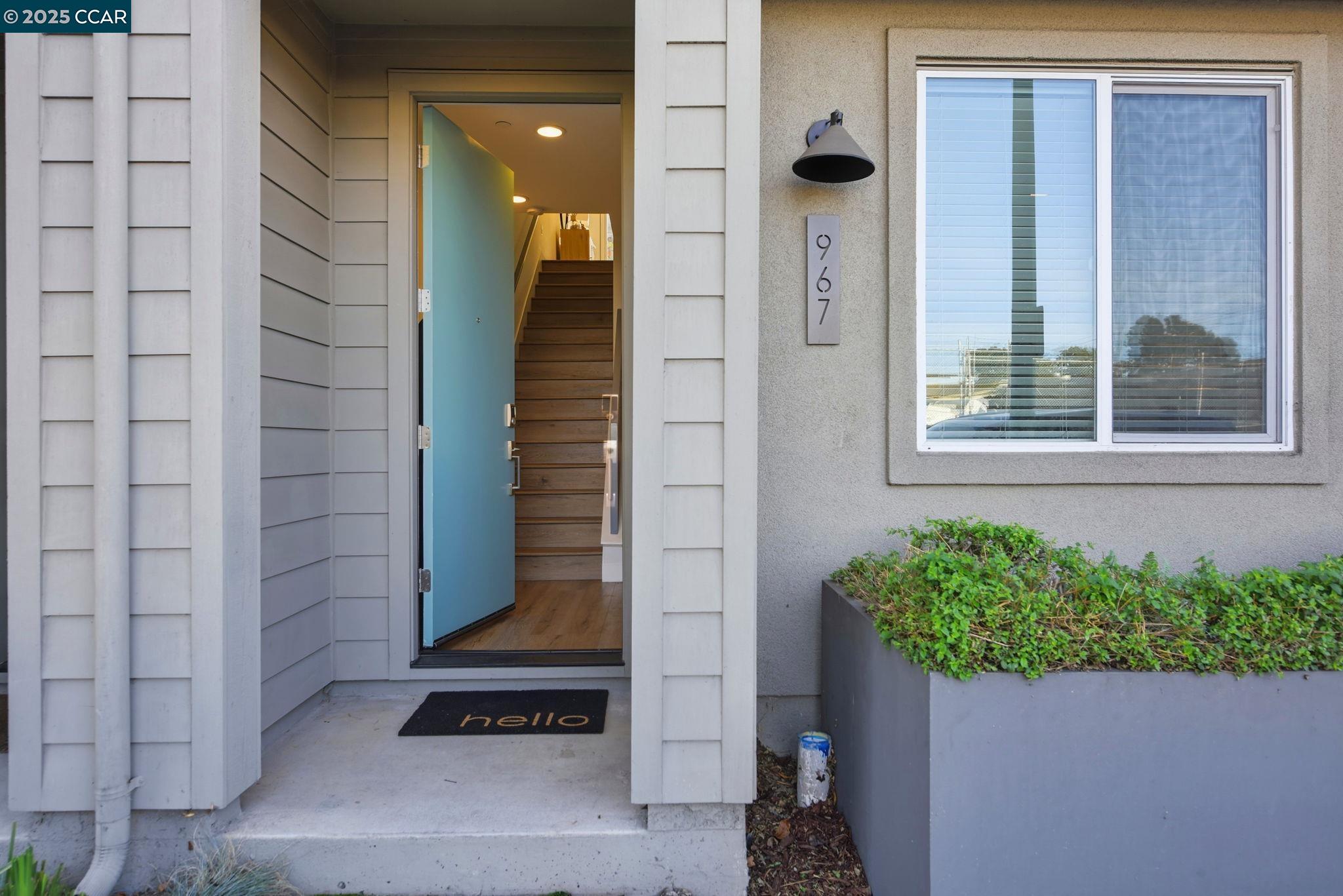 967 24th Street Oakland, CA 94607 - Photo 2 of 43 a front view of a house with a potted plant