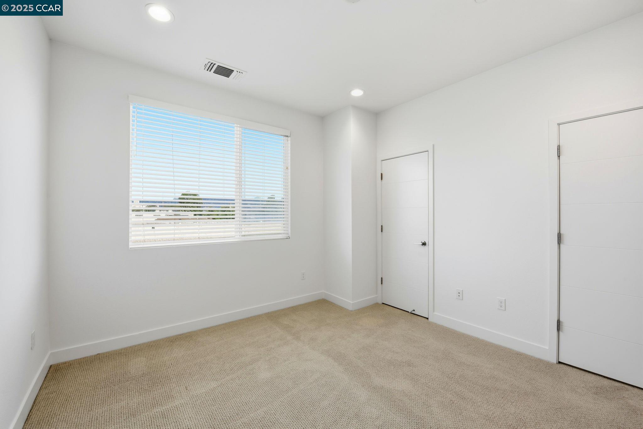 967 24th Street Oakland, CA 94607 - Photo 22 of 43 a view of an empty room with a window