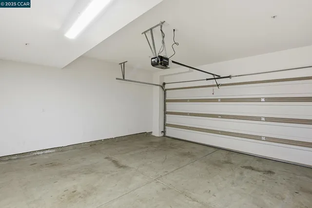 a view of a storage & utility room with two washing machine