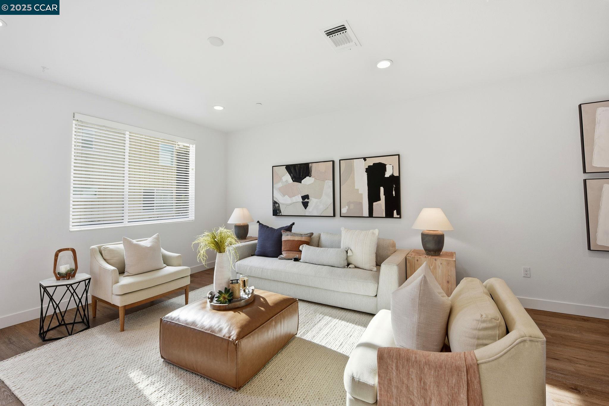 967 24th Street Oakland, CA 94607 - Photo 10 of 43 a living room with furniture and a large window