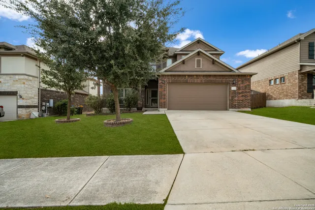 a front view of house with yard and green space