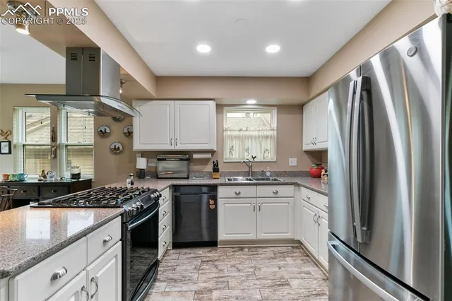 a kitchen with a sink stove and refrigerator