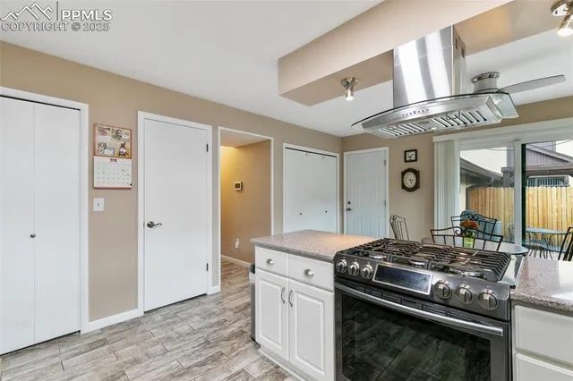 a kitchen with a stove and a refrigerator