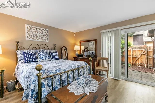 a bedroom with furniture and a window