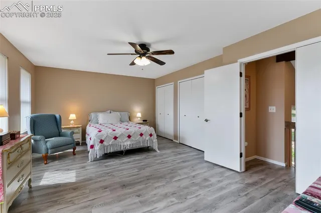 a bedroom with furniture and wooden floor
