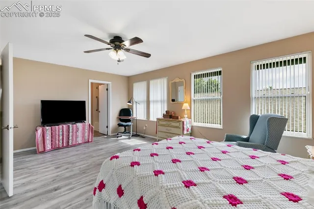 a bedroom that has a bed and a table in it