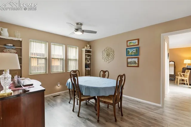a view of a dining room with furniture window and wooden floor