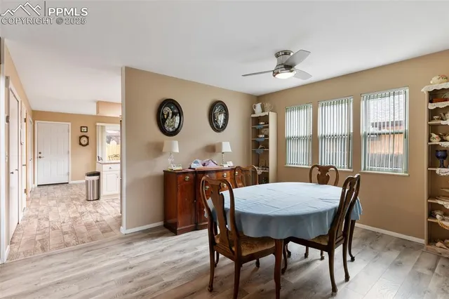 a view of a dining room with furniture window and wooden floor
