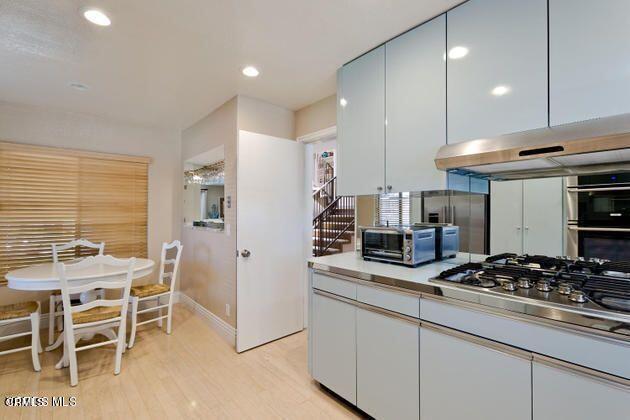 2121 Vina Del Mar Oxnard, CA 93035 - Photo 9 of 17 a kitchen with stainless steel appliances granite countertop a stove and a refrigerator
