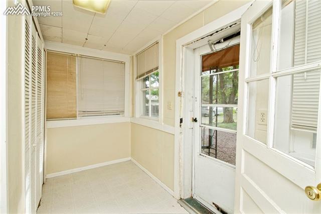 1132 Alexander Road Colorado Springs, CO 80909 - Photo 25 of 25 Mudroom out back yard with plenty of parking and large side yard/garden area