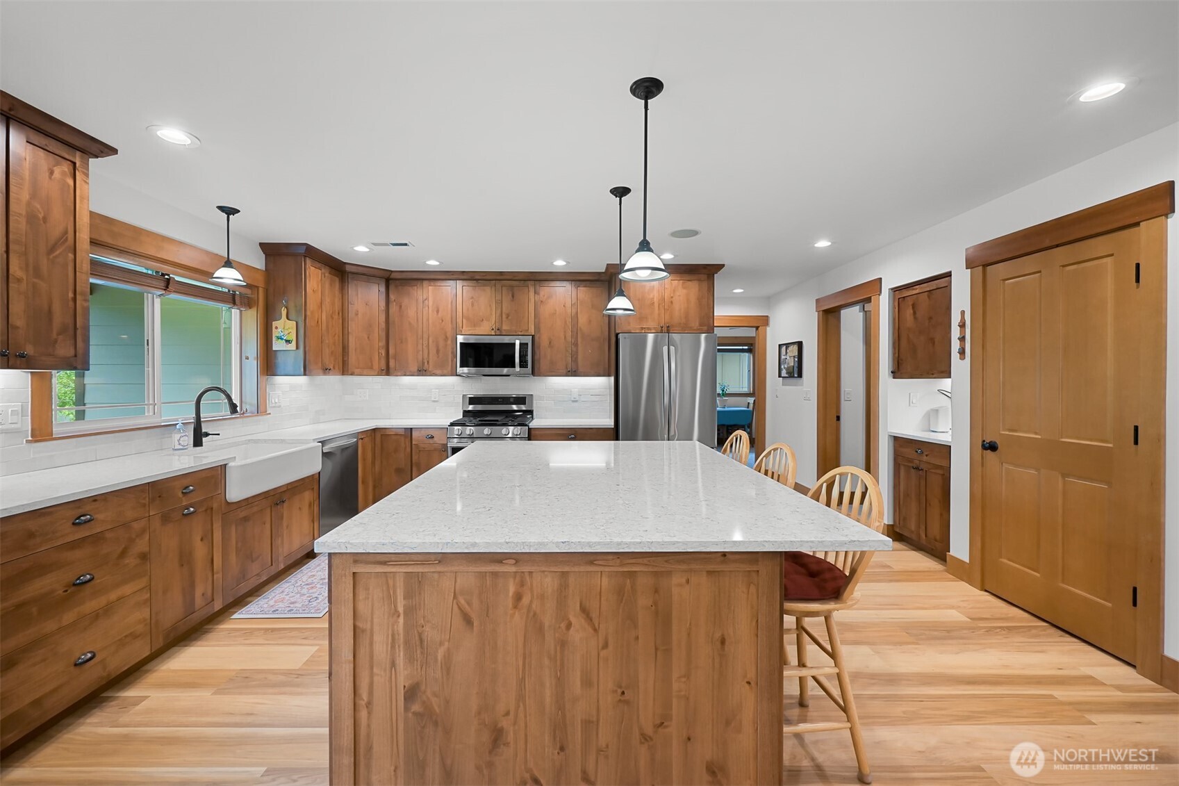502 Westview Place Nooksack, WA 98276 - Photo 8 of 30 a large kitchen with stainless steel appliances kitchen island a refrigerator and a sink