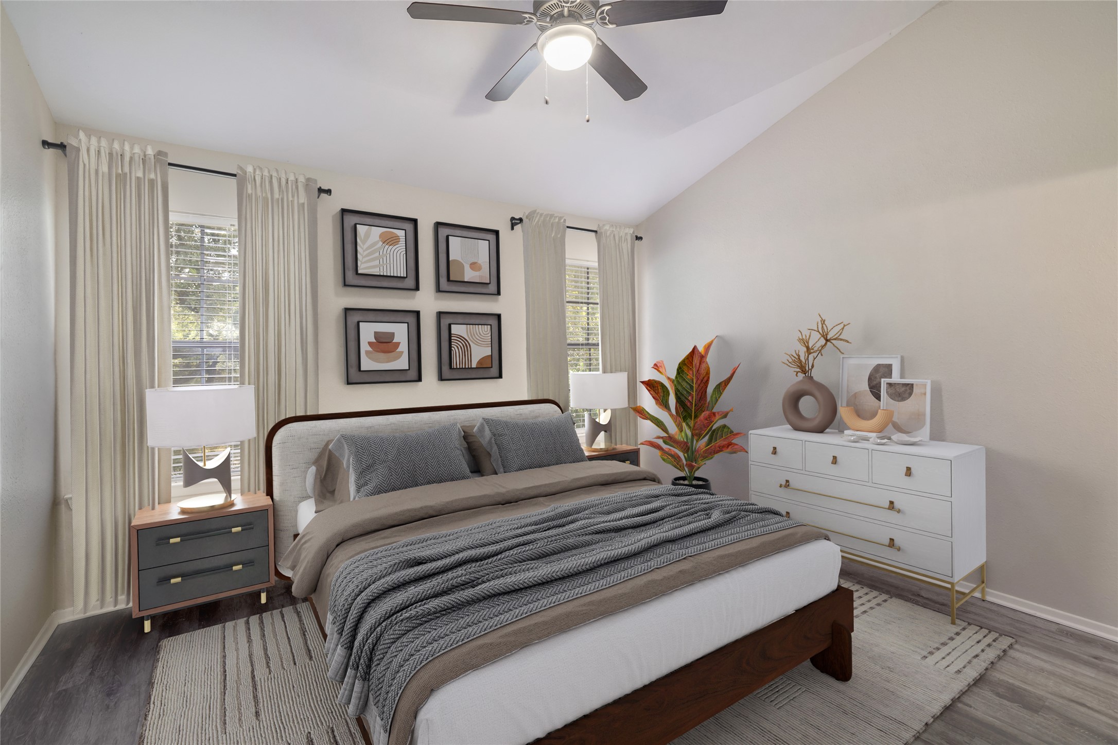 11404 Walnut Ridge Drive, Unit 4 Austin, TX 78753 - Photo 10 of 15 a bedroom with a bed and wooden floor