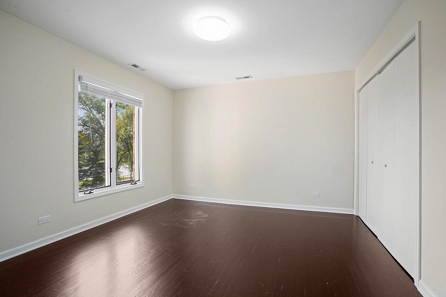 2134 Shermer Road Northbrook, IL 60062 - Photo 12 of 20 an empty room with wooden floor and windows