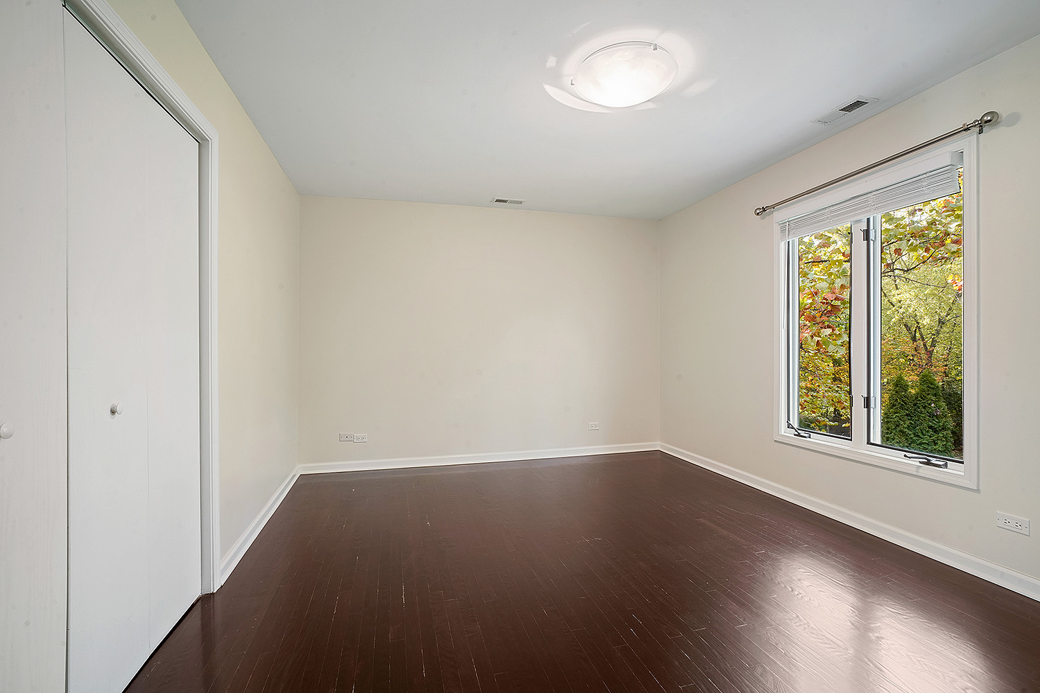 2134 Shermer Road Northbrook, IL 60062 - Photo 13 of 20 an empty room with wooden floor and windows