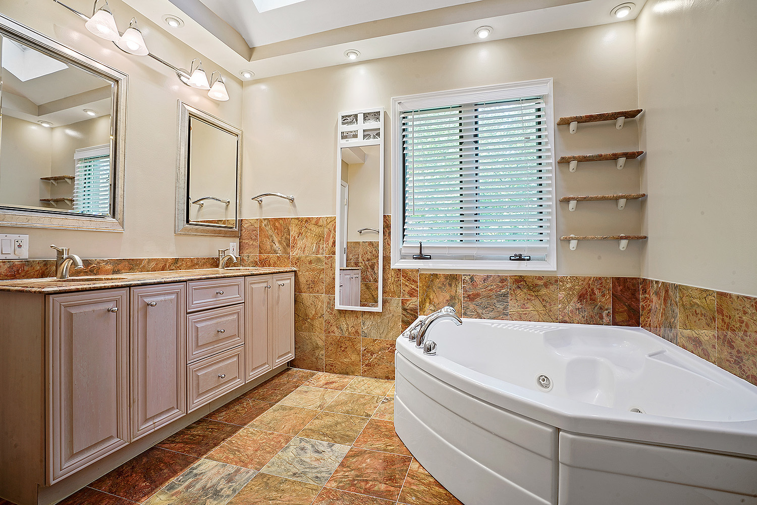 2134 Shermer Road Northbrook, IL 60062 - Photo 15 of 20 a bathroom with a granite countertop tub sink and mirror