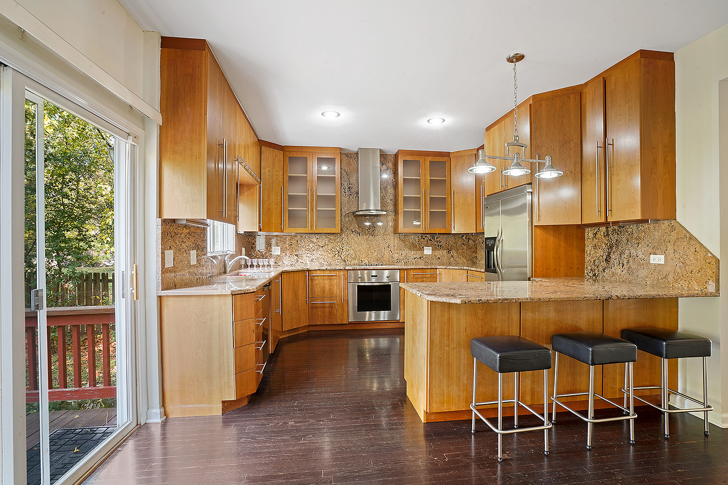 2134 Shermer Road Northbrook, IL 60062 - Photo 6 of 20 a kitchen with stainless steel appliances granite countertop a stove and white cabinets