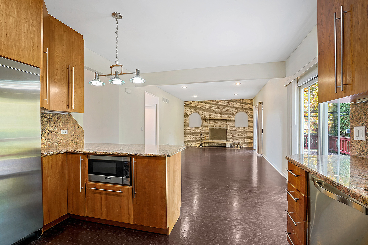 2134 Shermer Road Northbrook, IL 60062 - Photo 7 of 20 a open kitchen with stainless steel appliances granite countertop a stove and a wooden floors