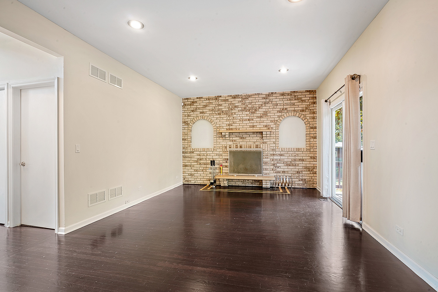 2134 Shermer Road Northbrook, IL 60062 - Photo 8 of 20 a view of an empty room with wooden floor and a window