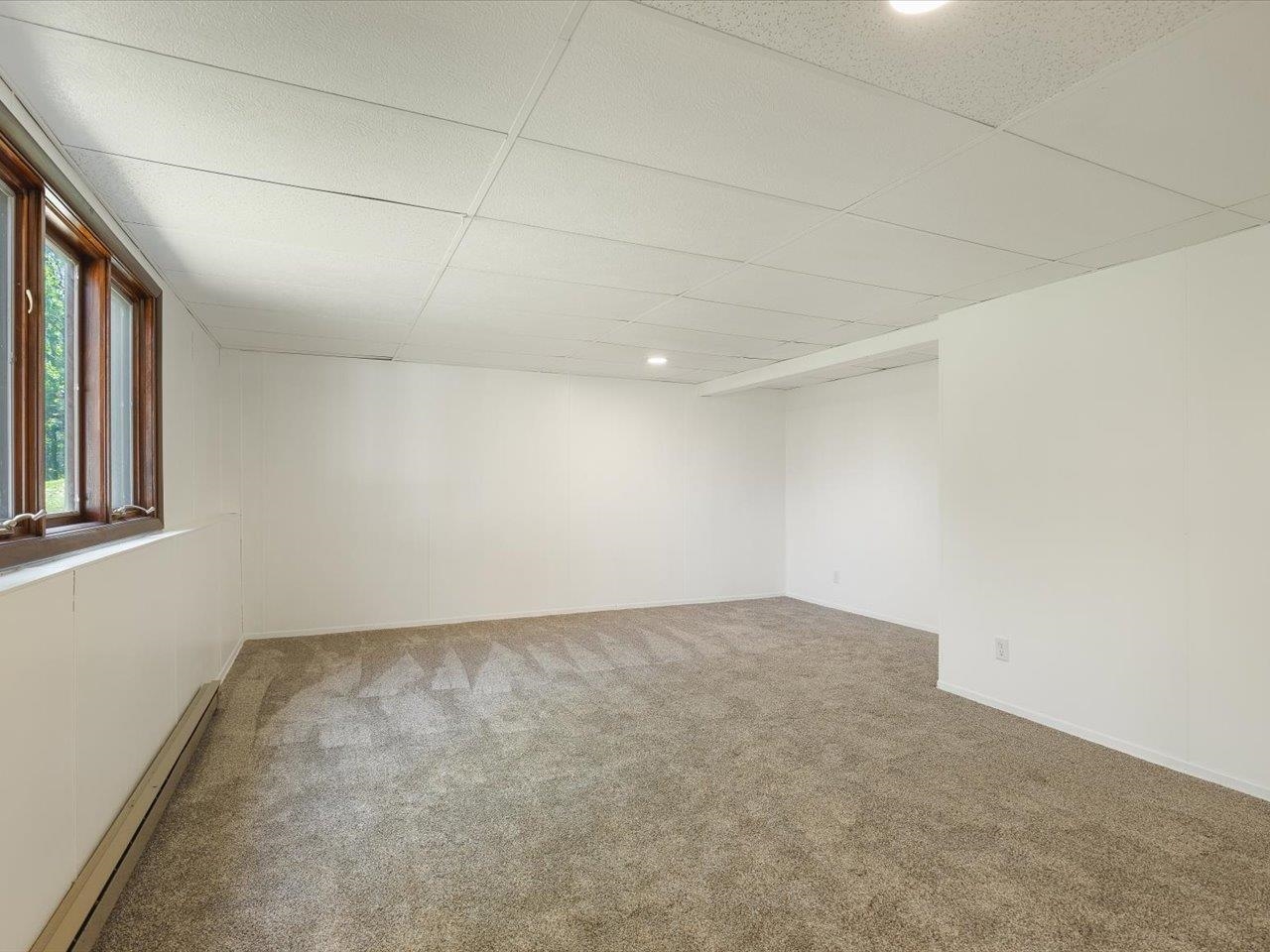 136 Lake Summerset Road Lake Summerset, IL 61019 - Photo 22 of 47 an empty room with a empty space and windows