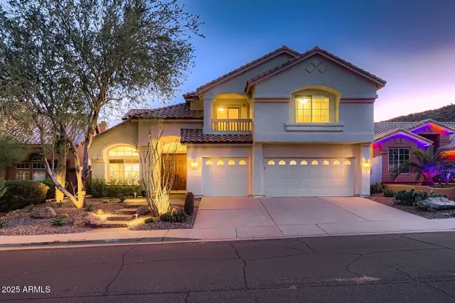 a view of a house with a yard and garage