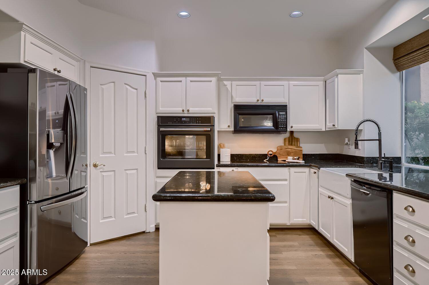 761 East Mountain Sky Avenue Phoenix, AZ 85048 - Photo 11 of 28 a kitchen with a refrigerator stove and sink
