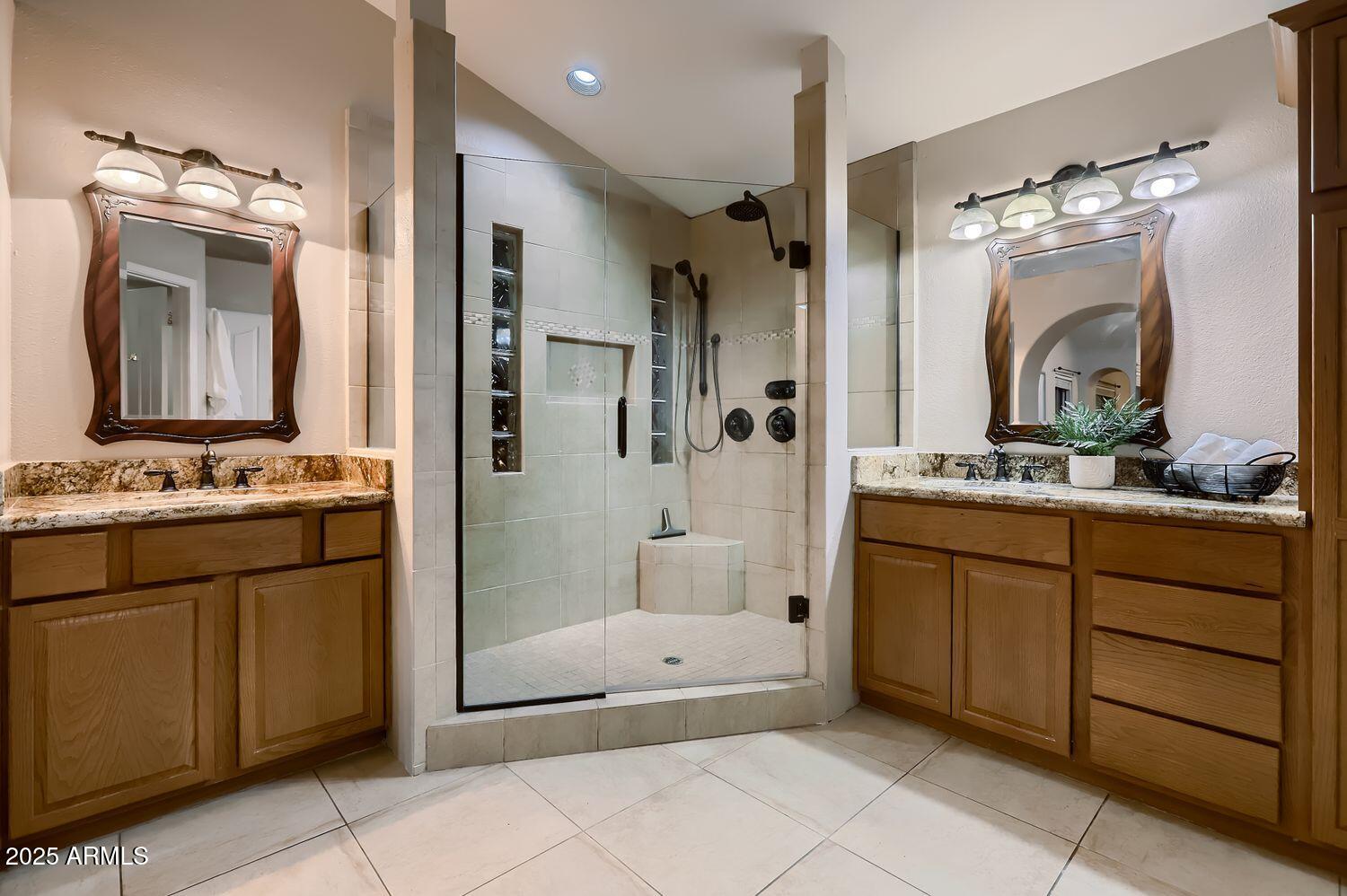 761 East Mountain Sky Avenue Phoenix, AZ 85048 - Photo 19 of 28 a bathroom with a granite countertop sink mirror and a bathtub