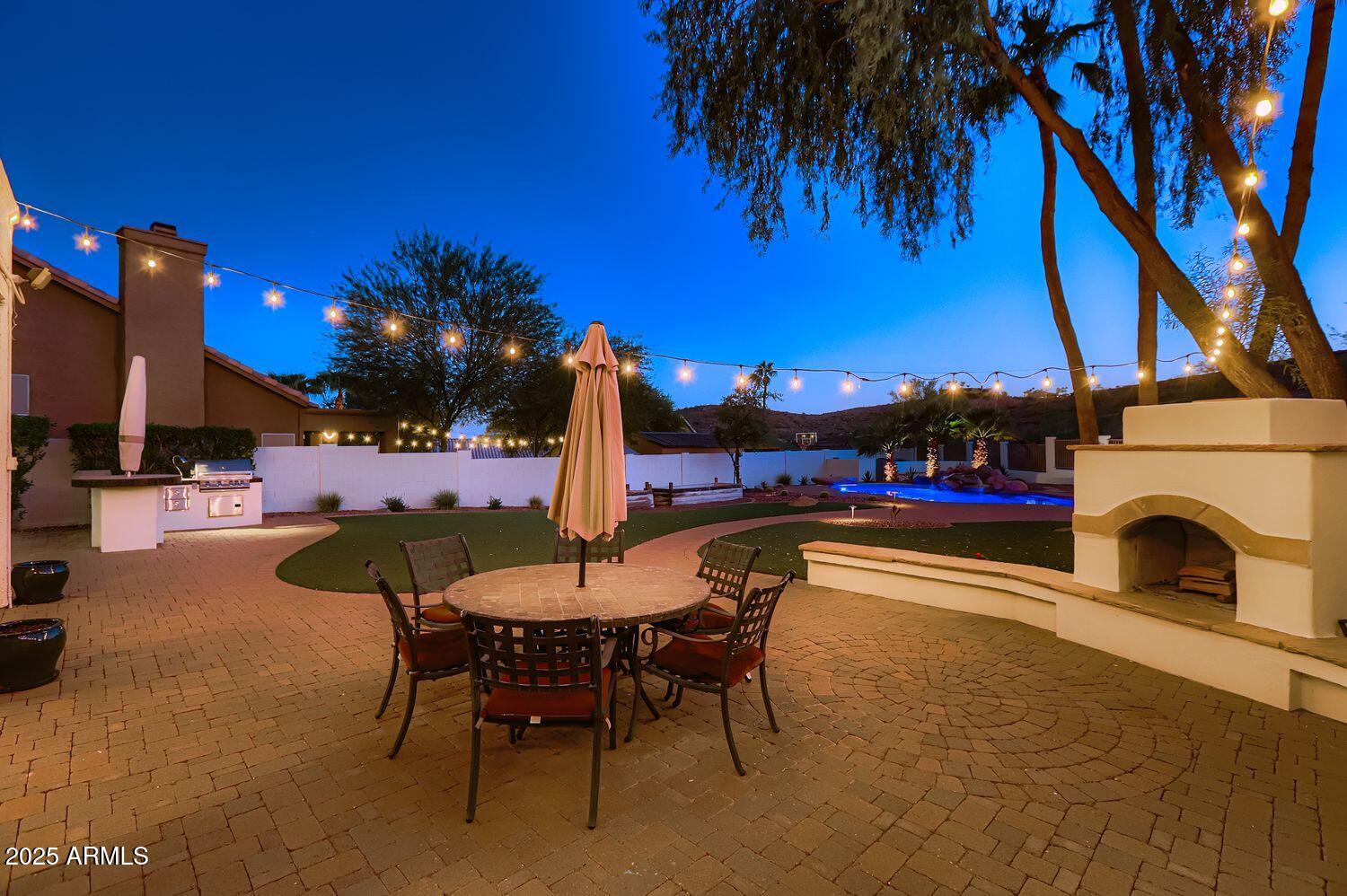 761 East Mountain Sky Avenue Phoenix, AZ 85048 - Photo 27 of 28 a view of a swimming pool with a table and chairs
