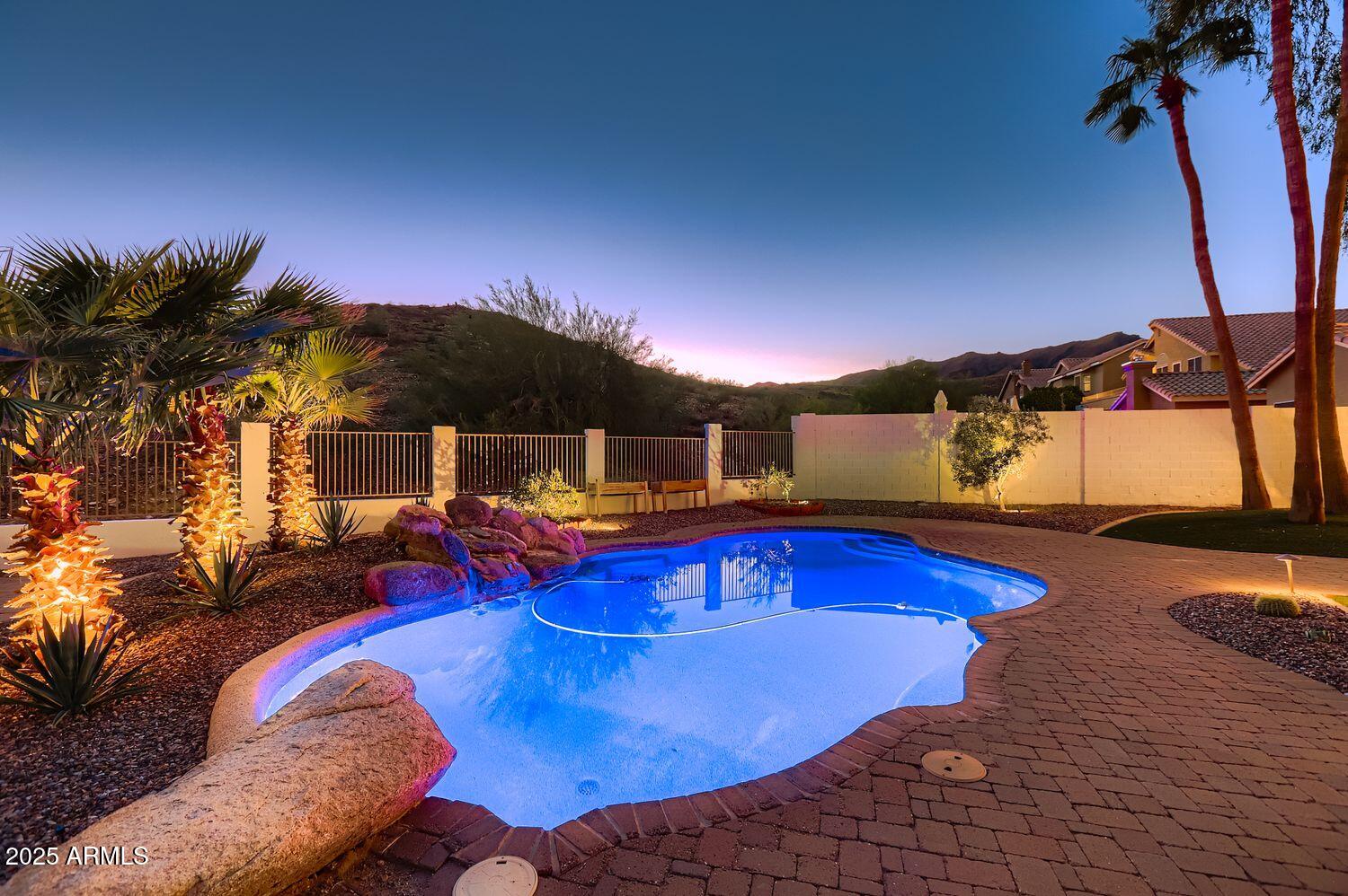 761 East Mountain Sky Avenue Phoenix, AZ 85048 - Photo 4 of 28 a view of a swimming pool with a patio