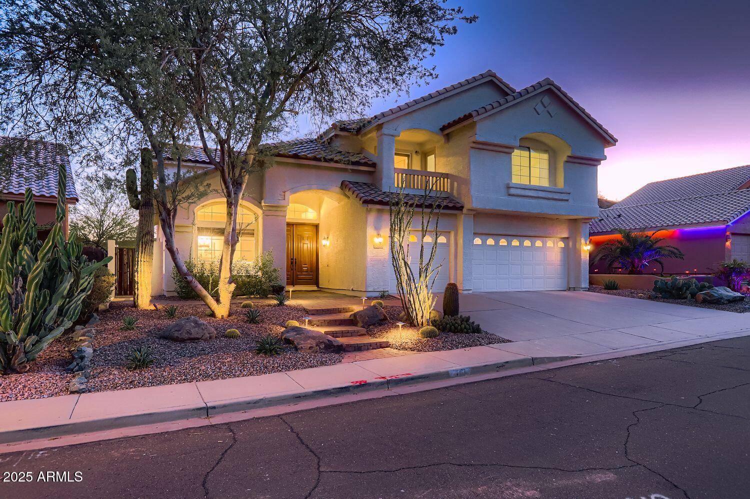 761 East Mountain Sky Avenue Phoenix, AZ 85048 - Photo 5 of 28 a front view of a house with garden