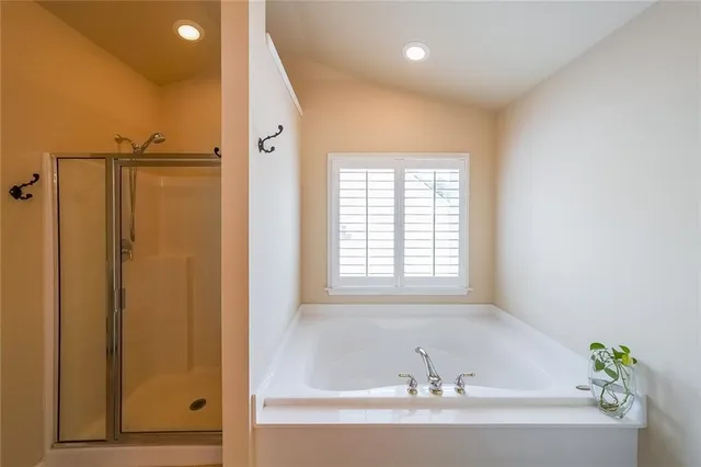 a bathroom with a shower and a sink
