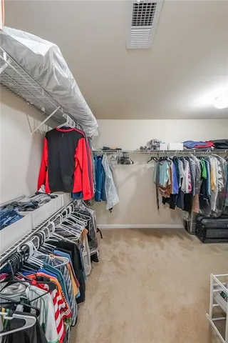 a bathroom with a sink a toilet and a shower curtain