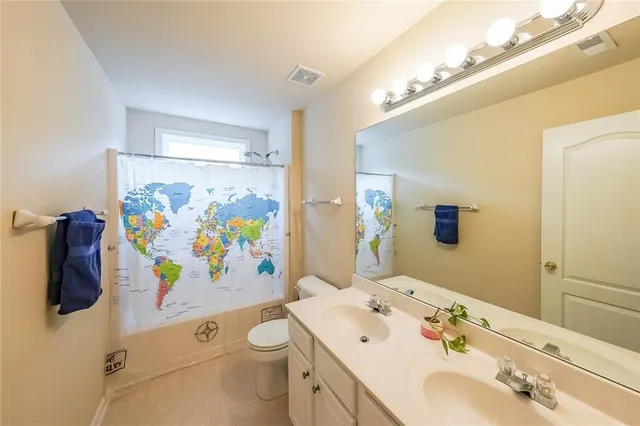 a bed room with a bed and a chandelier