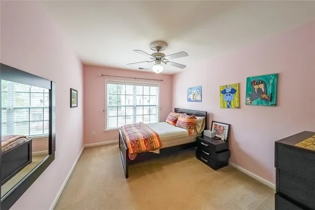 a bedroom with a bed and lounge chair