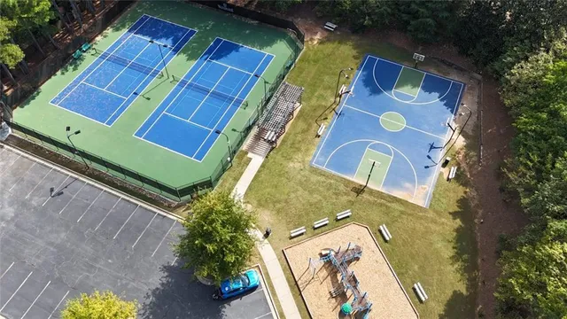 an aerial view of a house with a yard and plants