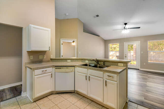 122 Bayou Landing Road Miramar Beach, FL 32550 - Photo 11 of 27 a kitchen with a sink stove and cabinets