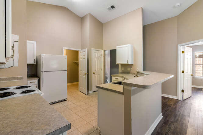 122 Bayou Landing Road Miramar Beach, FL 32550 - Photo 12 of 27 a kitchen with a refrigerator and a stove