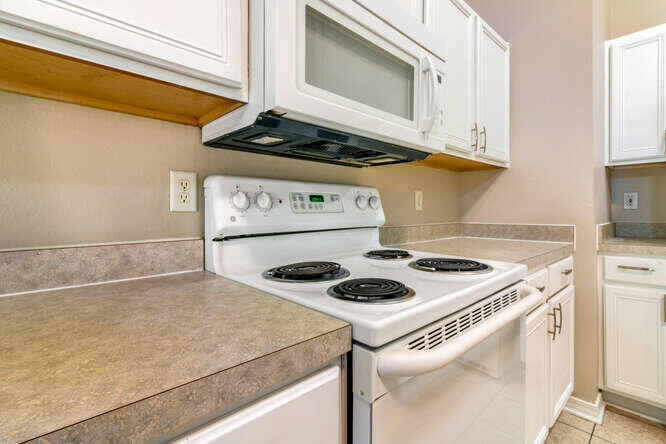 122 Bayou Landing Road Miramar Beach, FL 32550 - Photo 14 of 27 a kitchen with a stove and a microwave