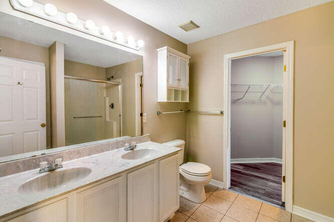 122 Bayou Landing Road Miramar Beach, FL 32550 - Photo 21 of 27 a bathroom with a granite countertop sink toilet and shower