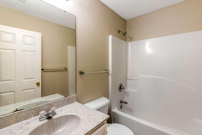122 Bayou Landing Road Miramar Beach, FL 32550 - Photo 22 of 27 a bathroom with a bathtub shower sink and toilet