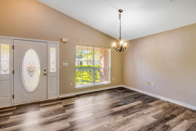 122 Bayou Landing Road Miramar Beach, FL 32550 - Photo 3 of 27 a view of a room with wooden floor fan and windows