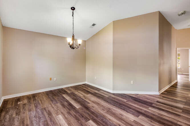 122 Bayou Landing Road Miramar Beach, FL 32550 - Photo 4 of 27 a view of a room with wooden floor and ceiling fan