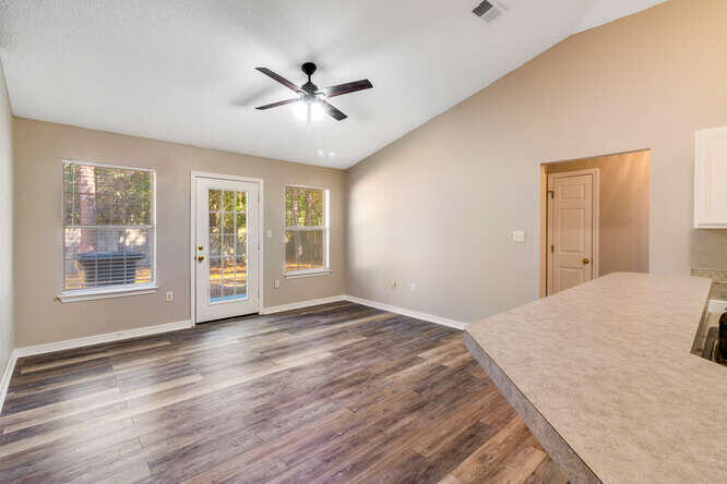 122 Bayou Landing Road Miramar Beach, FL 32550 - Photo 6 of 27 a view of empty room with wooden floor and fan